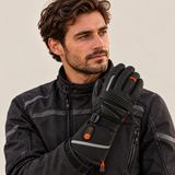 Man wearing a WASOTO WG002 heated glove against a beige background.